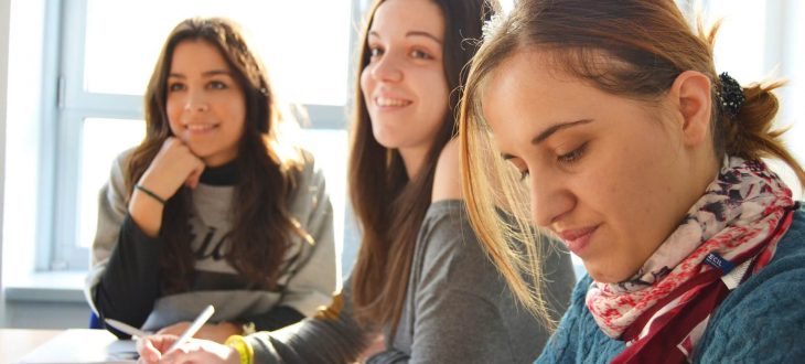 Decorative Image: Students learning together in a classroom